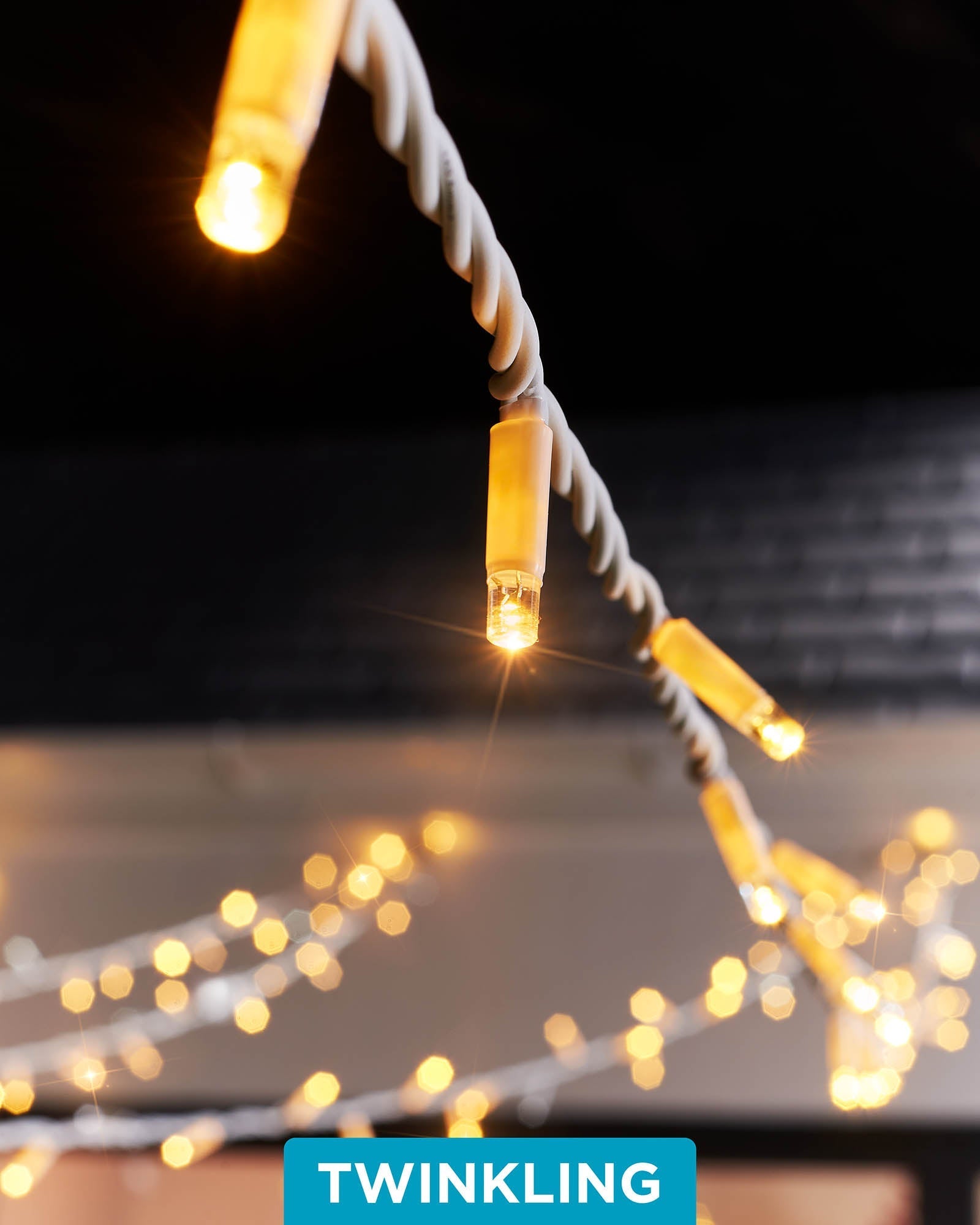 A close-up of connectable twinkle string lights with a focus on the LED bulbs, showcasing the twinkling feature.