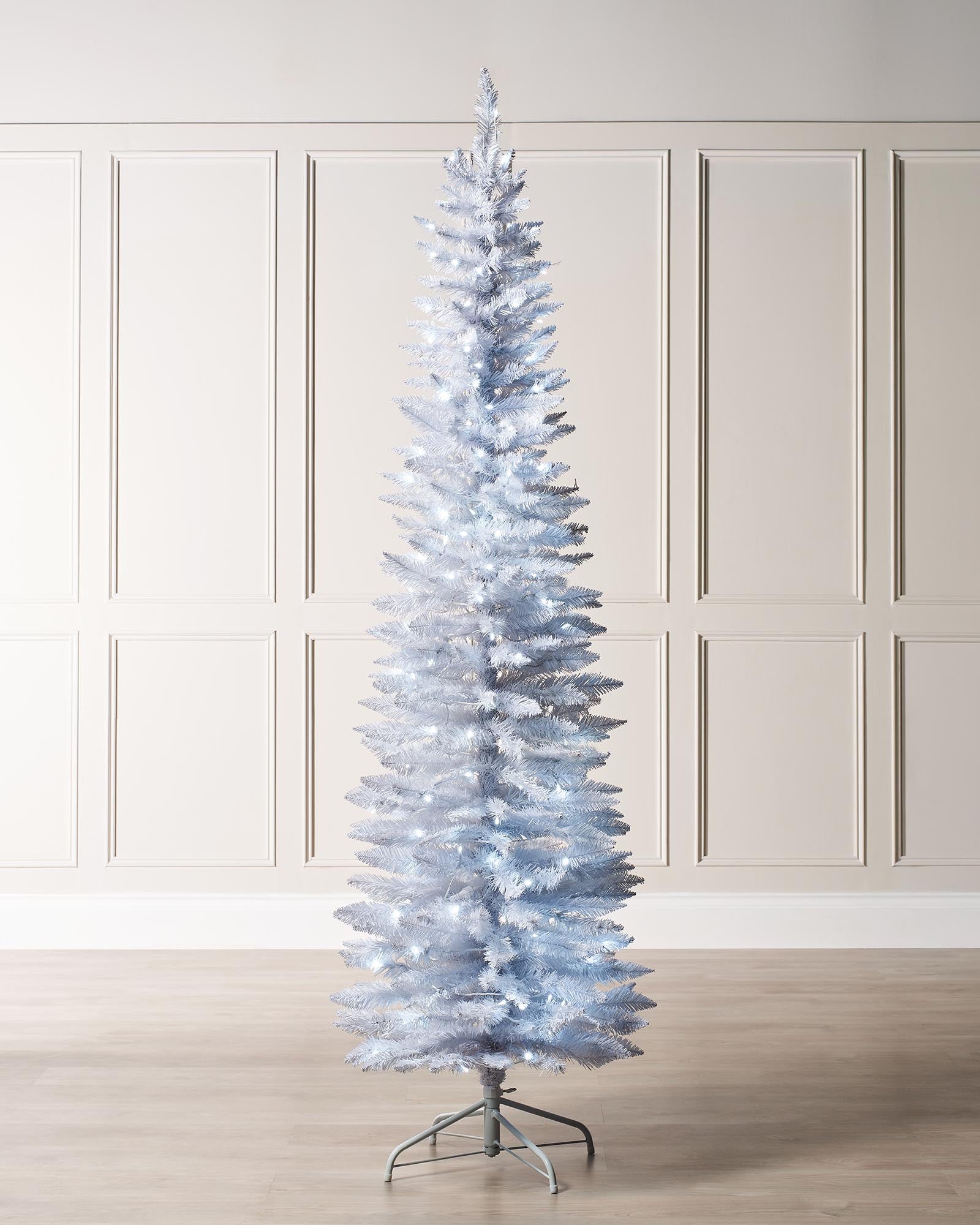 A pre-lit white pencil Christmas tree with slender branches, featuring 400 mixed PE and PVC tips and 180 bright white LED lights. The tree stands upright with a 64 cm diameter, blending modern elegance with festive charm.