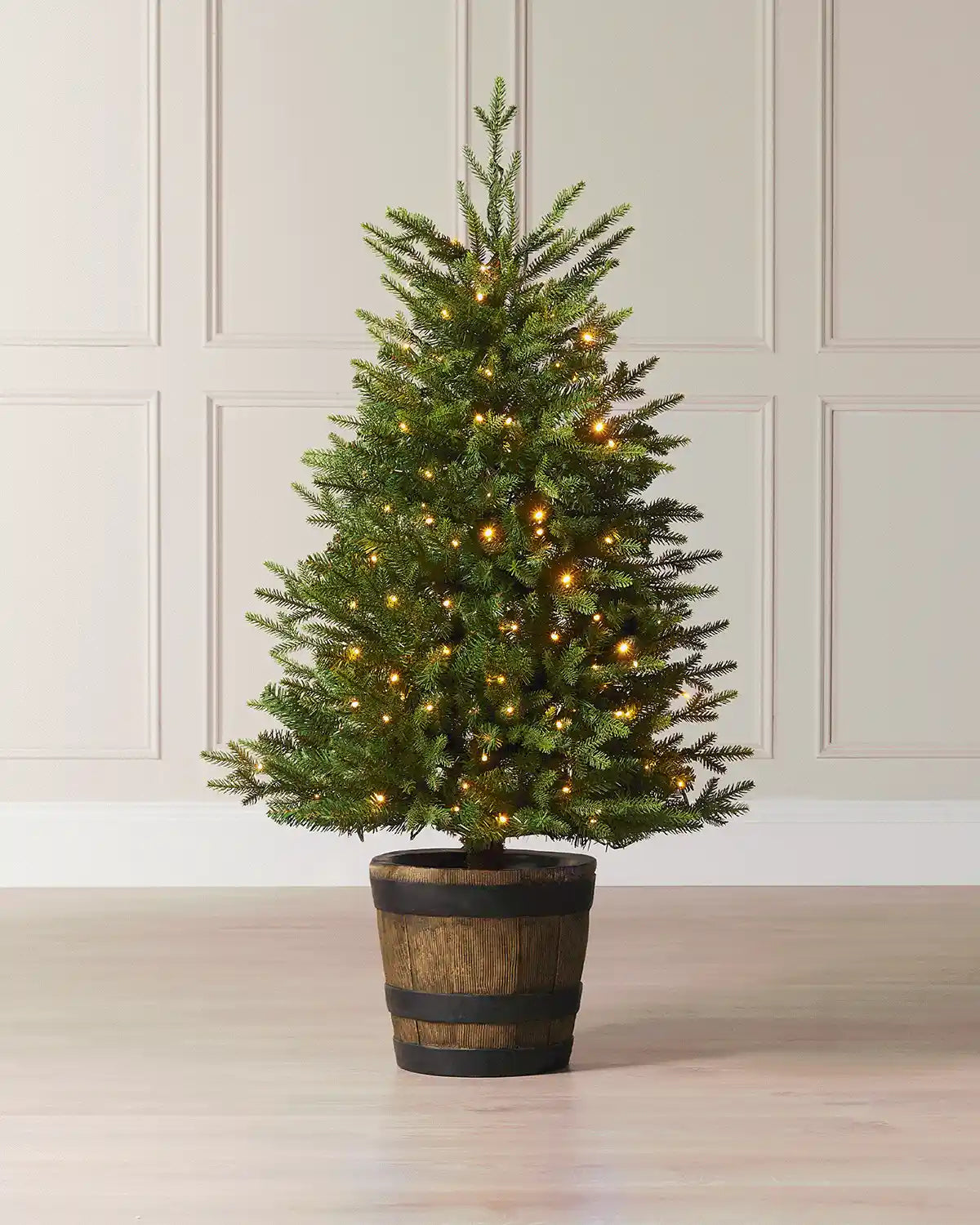 4 ft pre-lit potted pine Christmas tree with warm white lights in a rustic barrel-style pot