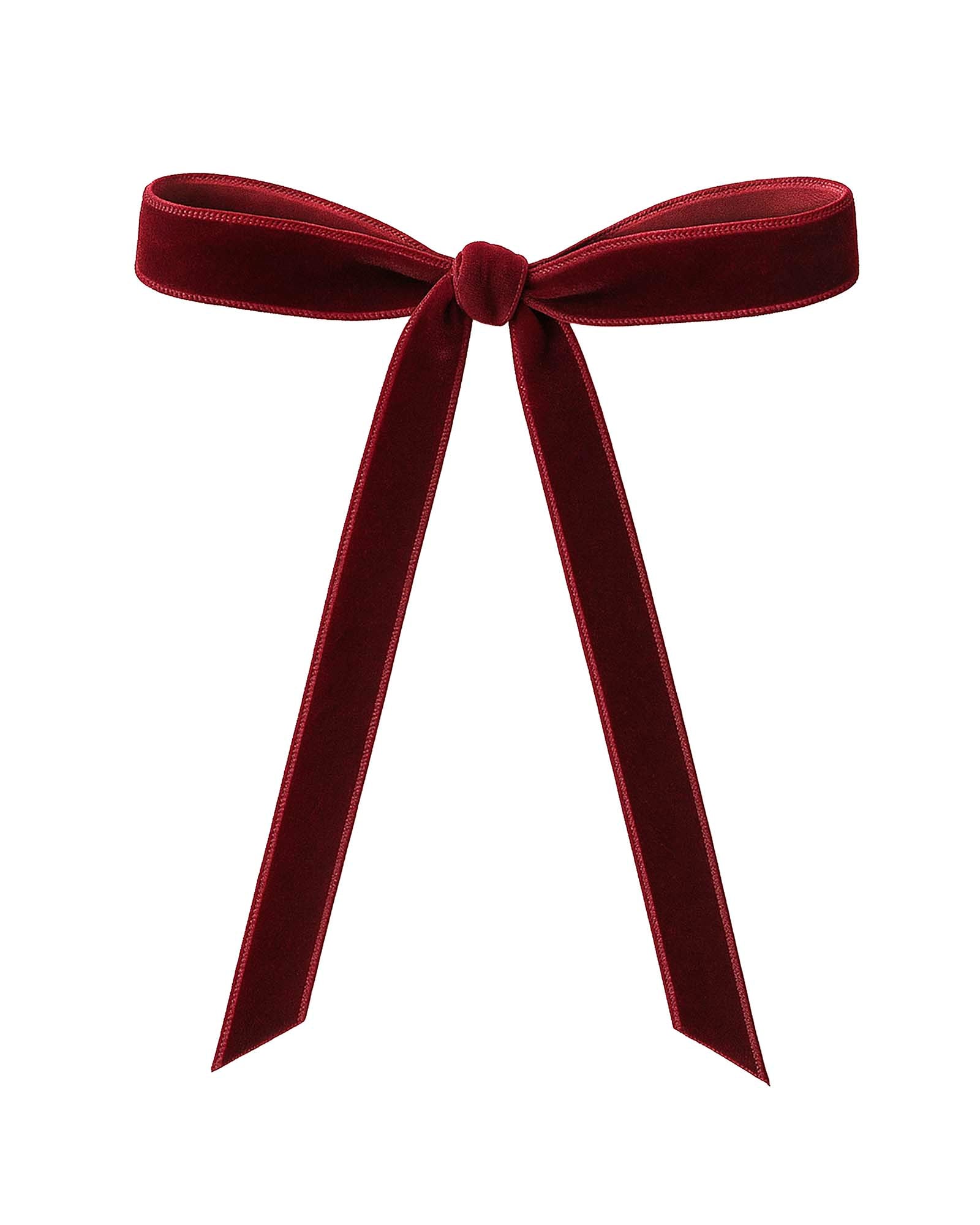 Red velvet bow on a white background