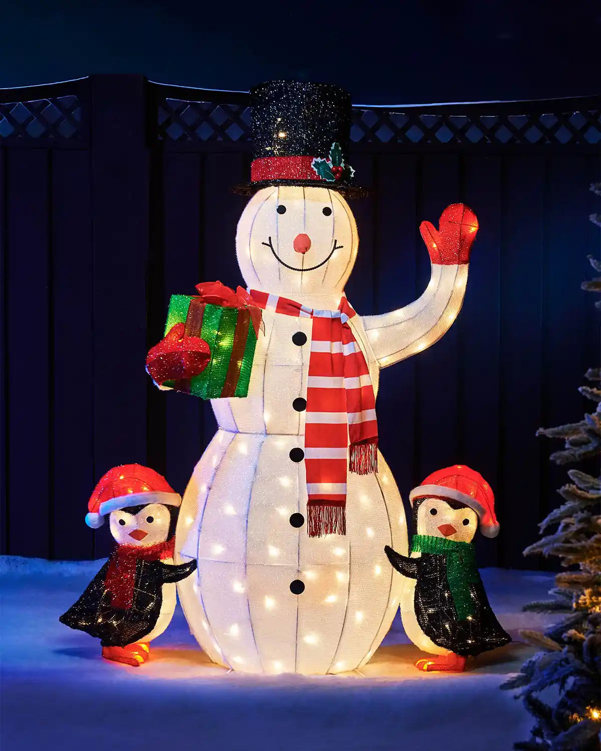 100cm pre-lit 3D snowman and penguin silhouette glowing in an outdoor Christmas display.
