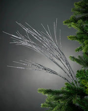 100cm silver glitter wispy spray on Christmas tree in front of grey background