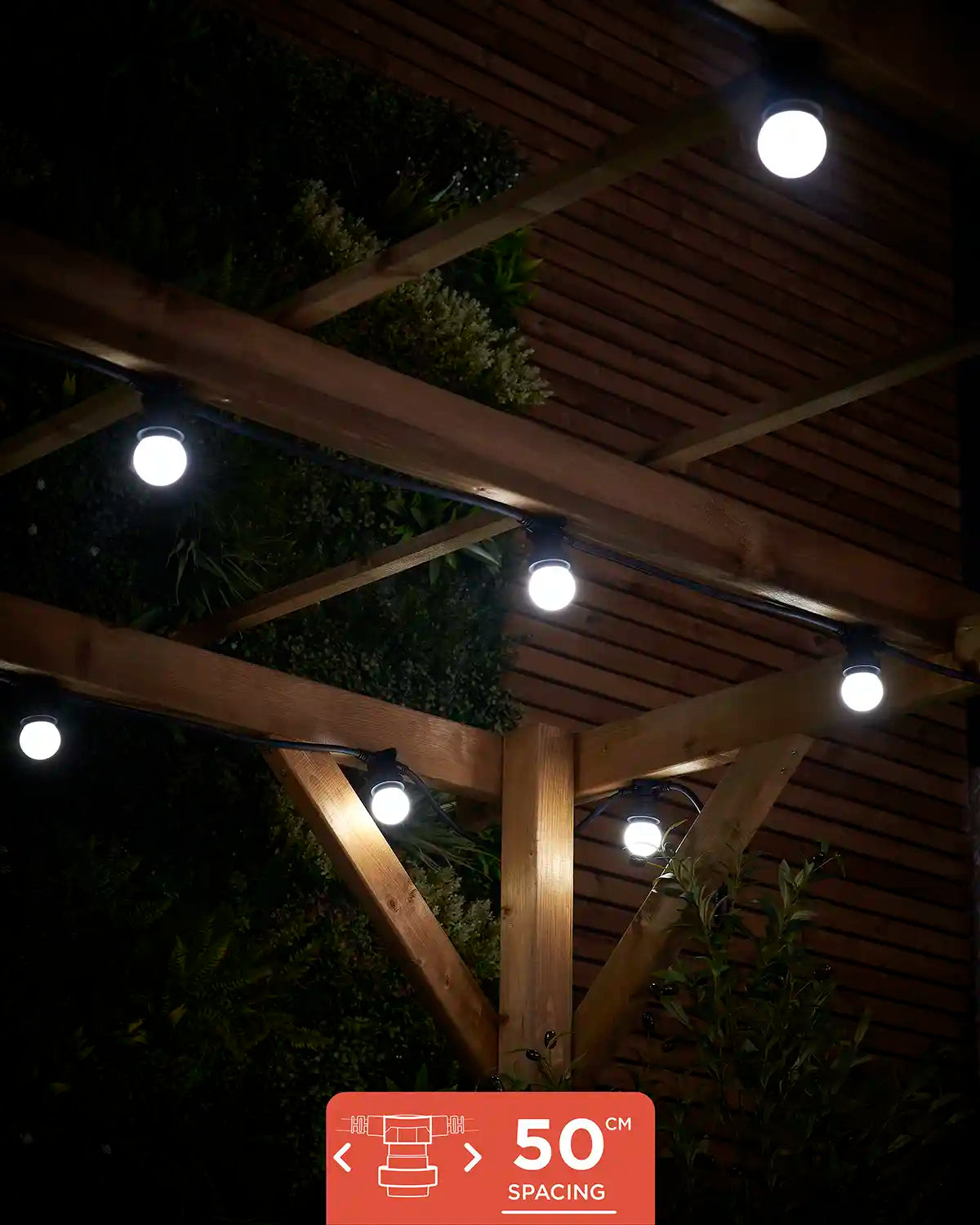 E27 festoon belt with 20 sockets and 50cm spacing shown lit in white under a wooden pergola.