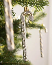 Close-up of a 13cm gold and white candy cane bauble hanging on a Christmas tree