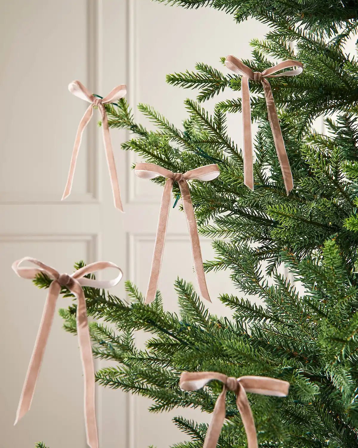 Set of mocha velvet bows attached to Christmas tree branches