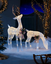 Pre-lit 3D reindeer pair displayed outdoors with warm white LEDs