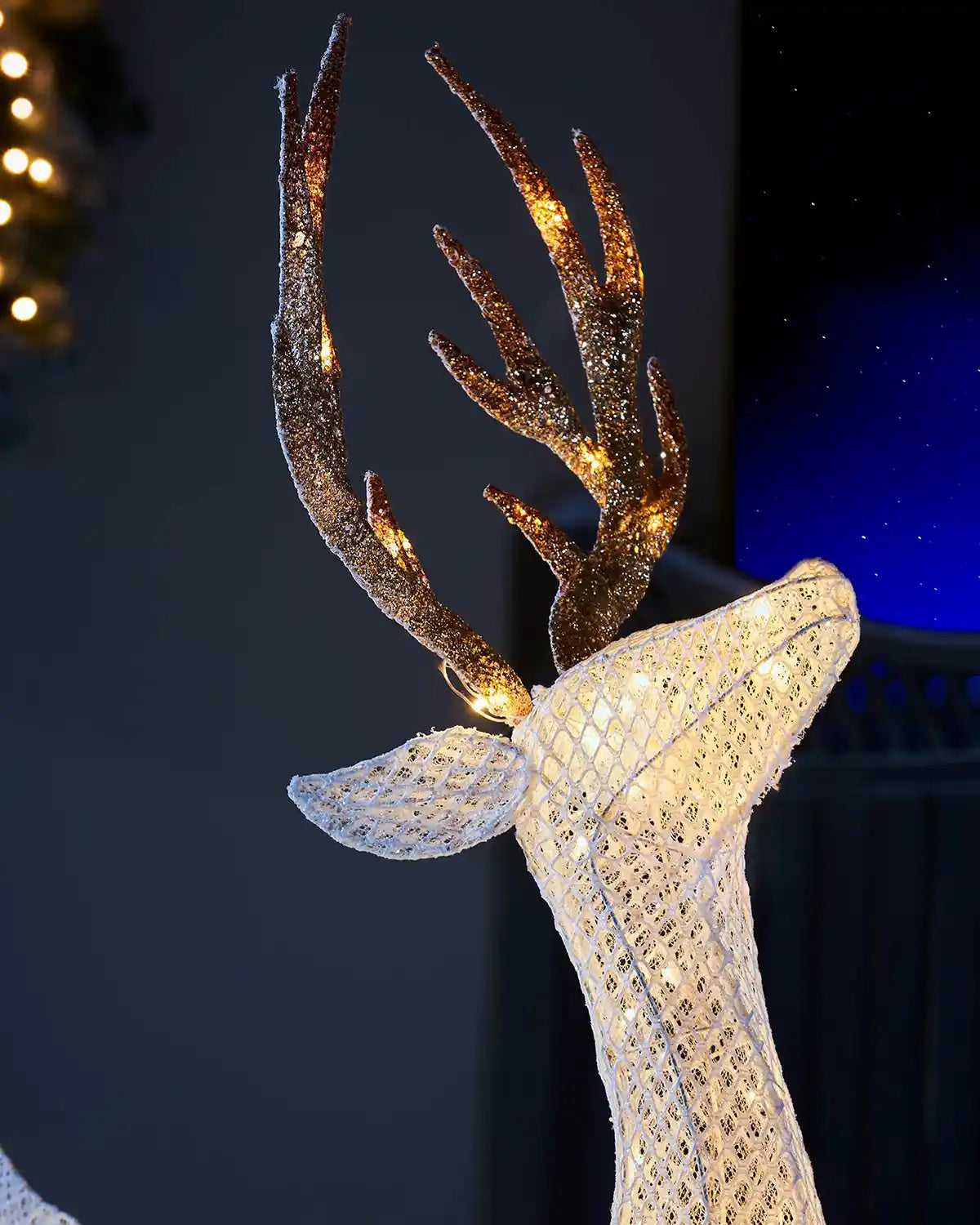 Close-up of the 151 cm pre-lit standing stag with glitter antlers and warm white LEDs