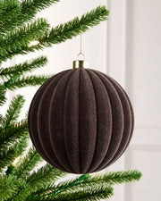 15 cm Espresso oversized velvet Ribbed bauble hanging from a Christmas tree with a gold cap.
