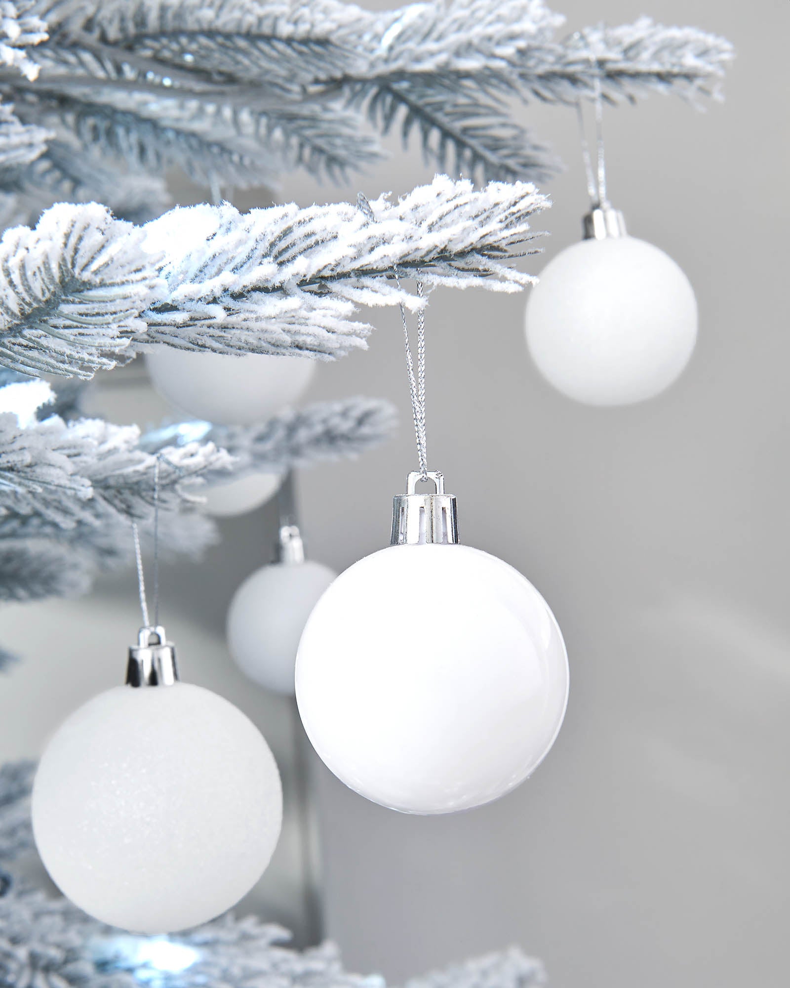 Fifty White Shatterproof Baubles