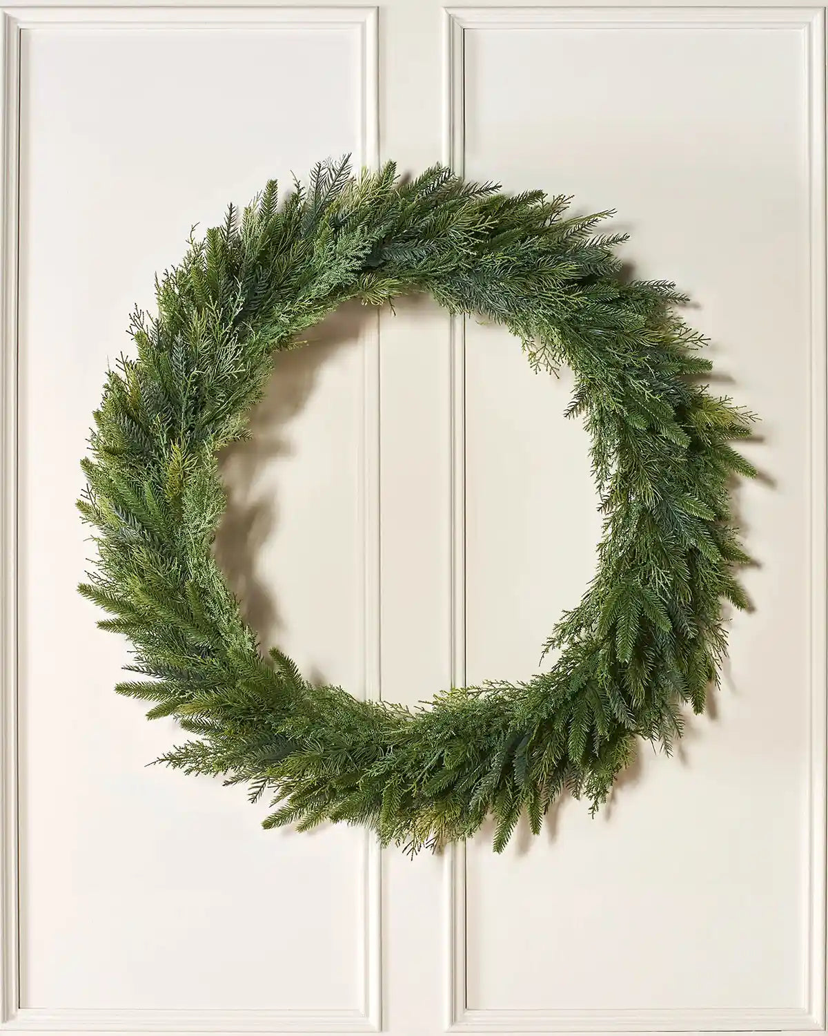 1 m natural fir wreath displayed on a lifestyle wall