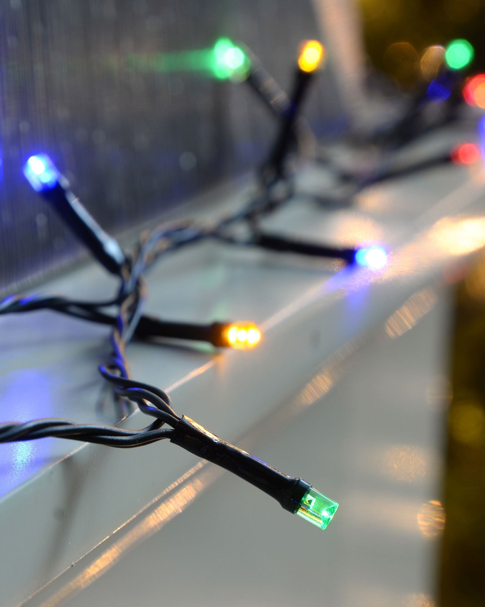 Close-up of a 200 LED multi-coloured light string with black cable