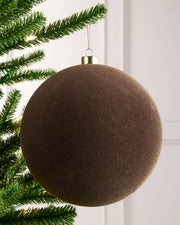20 cm Mocha oversized velvet Traditional bauble hanging from a Christmas tree with a gold cap.
