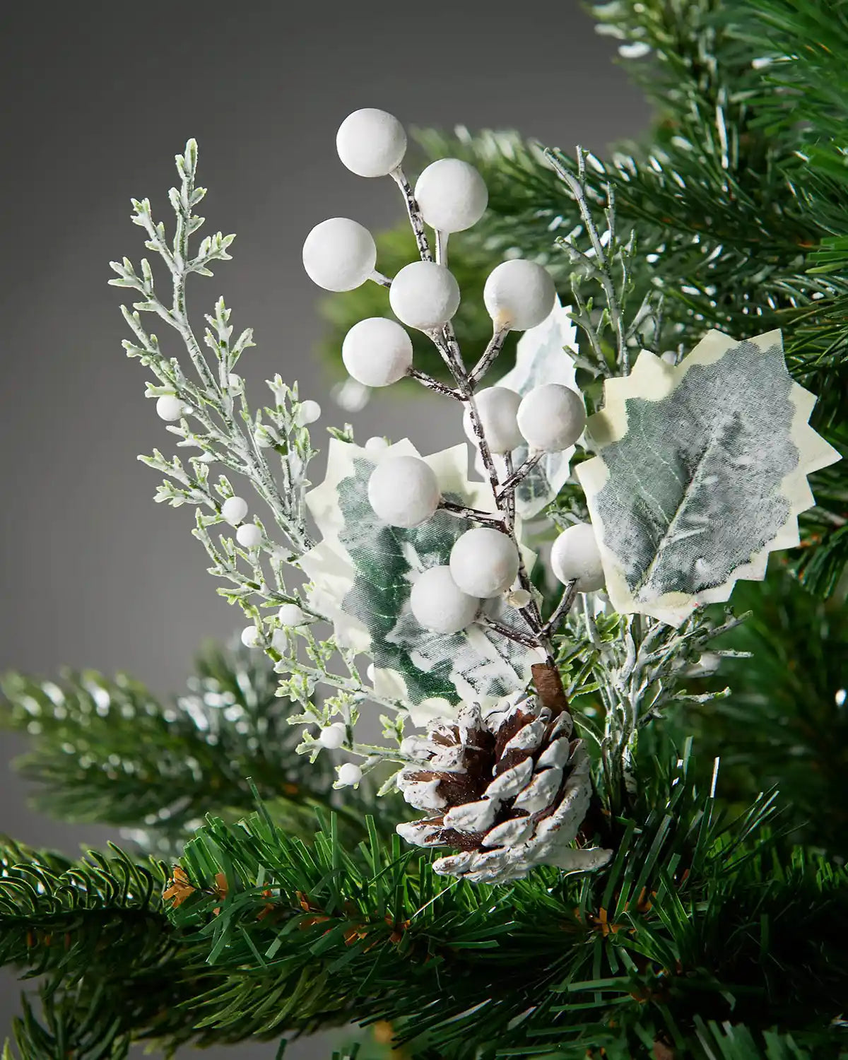 20 cm artificial frosted berries and pinecones pick styled in a Christmas tree