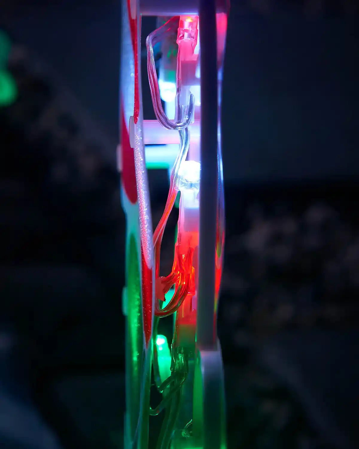 Side view showing the LED wiring and frame detail on a candy cane pathway light