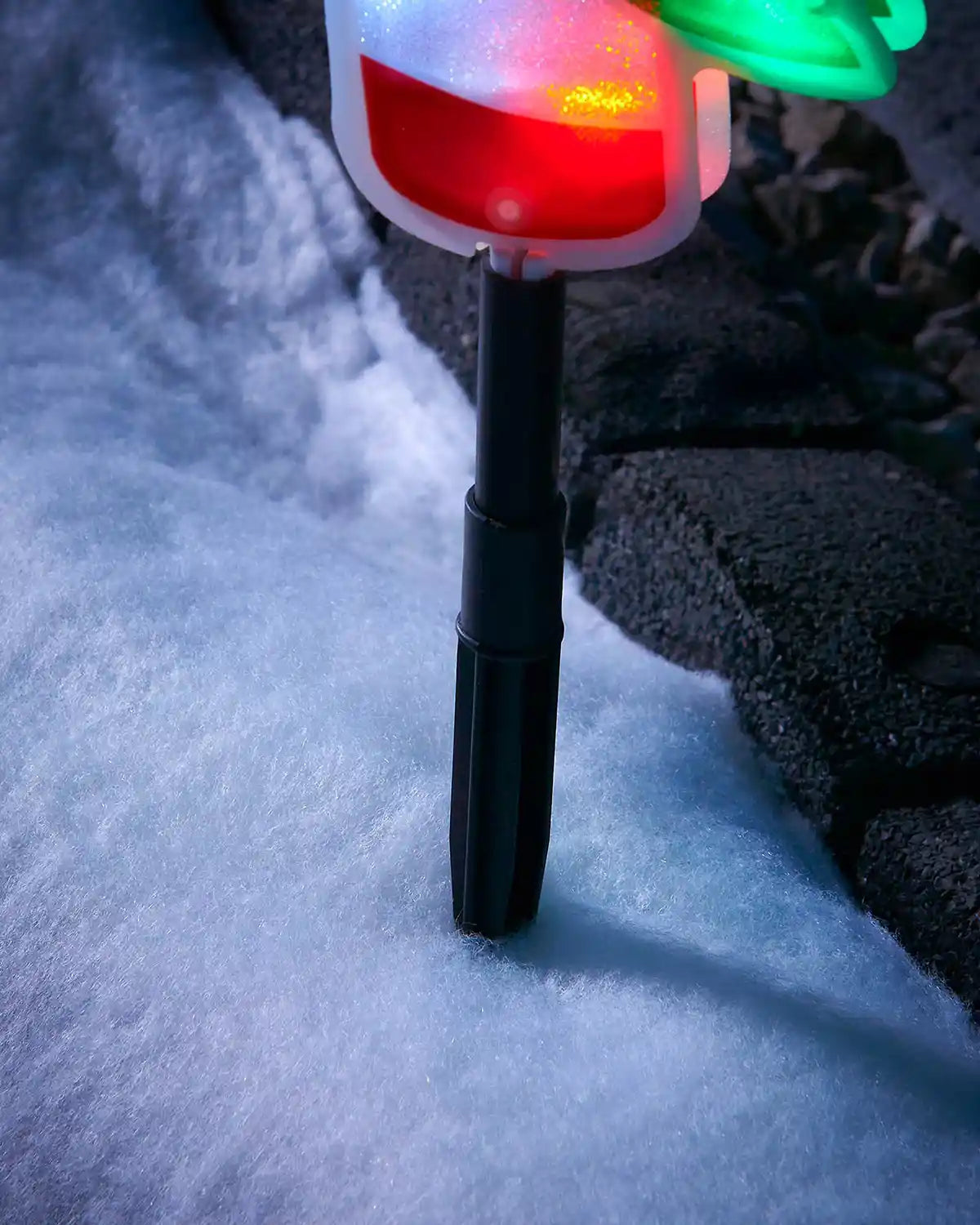 Close-up of the ground stake on a 24 cm candy cane pathway light
