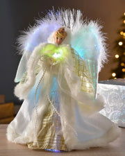 25cm cream and gold fibre optic angel tree topper displayed on a table with glowing coloured lights