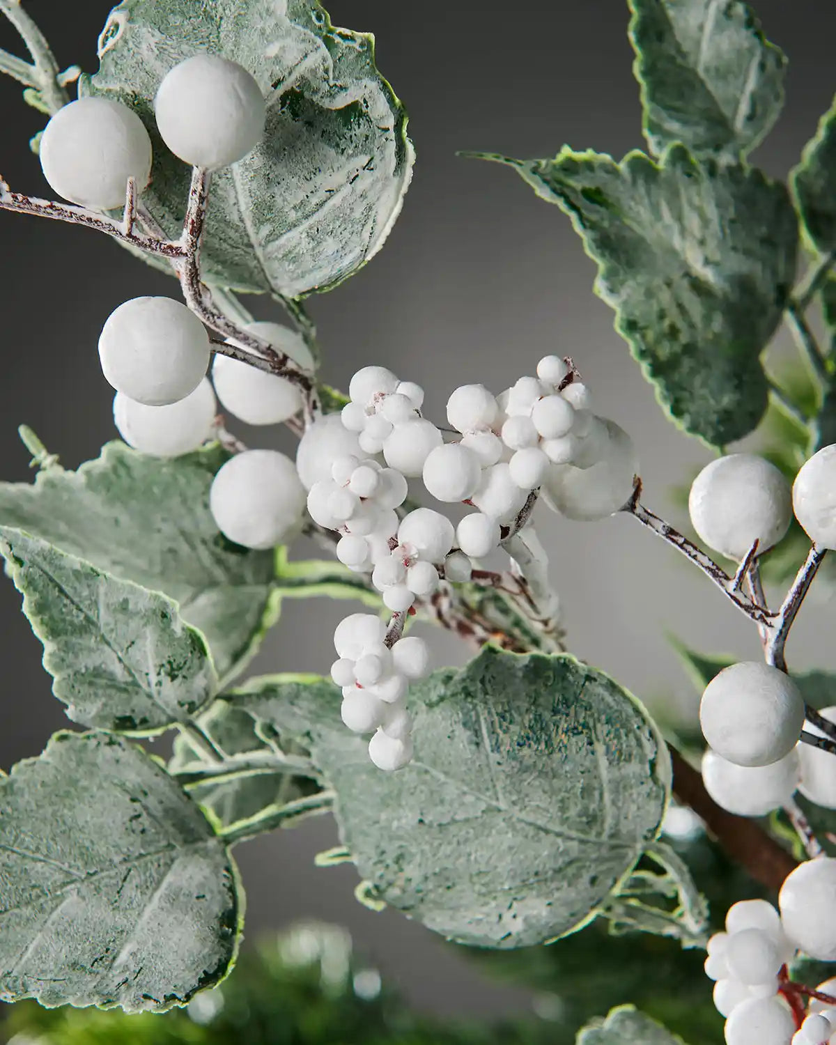 Close-up of the white berries and frosted foliage on the 25 cm artificial pick