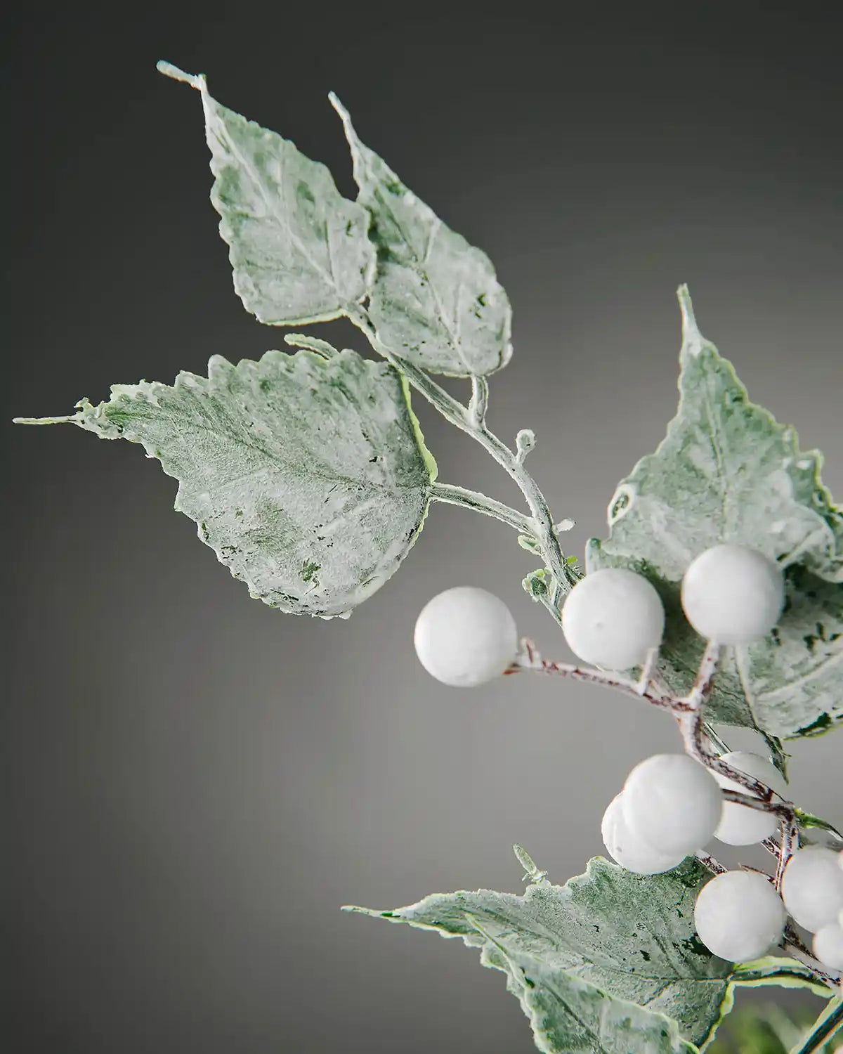 Close-up of the frosted leaves and white berries on the 25 cm artificial pick