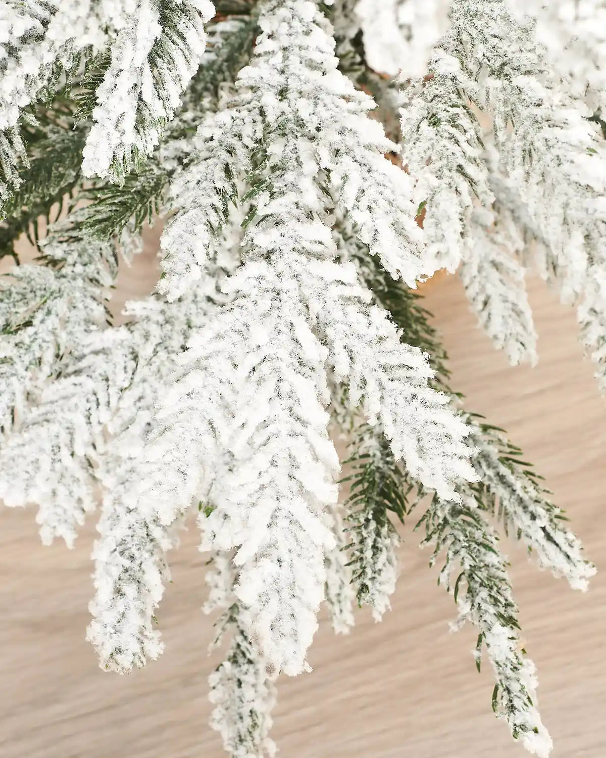 Close up of the snow flocked tips on a 2ft Snow flocked artificial Christmas tree. 