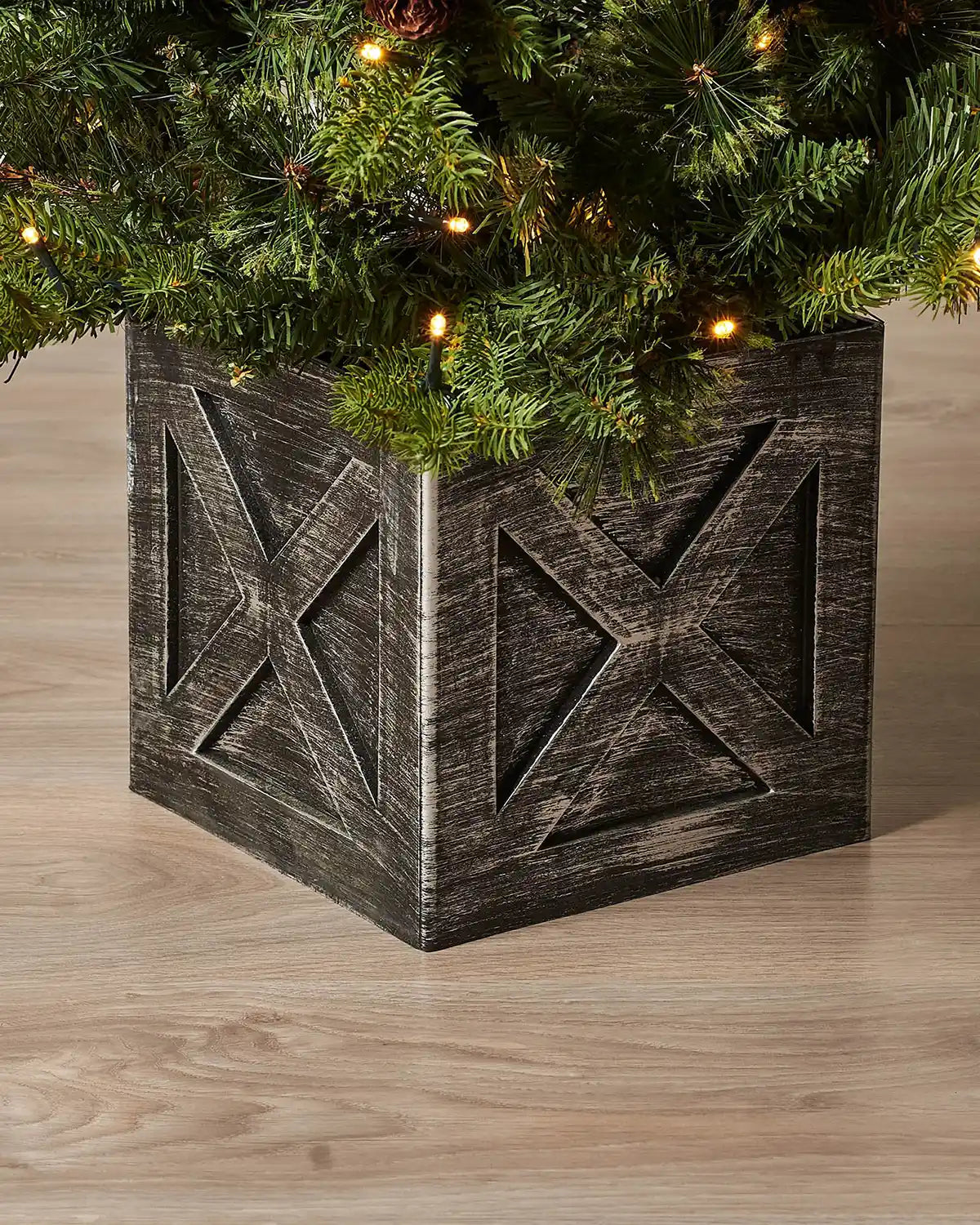 Close-up of the grey wooden-effect pot on a 3.5 ft pre-lit natural pine potted Christmas tree