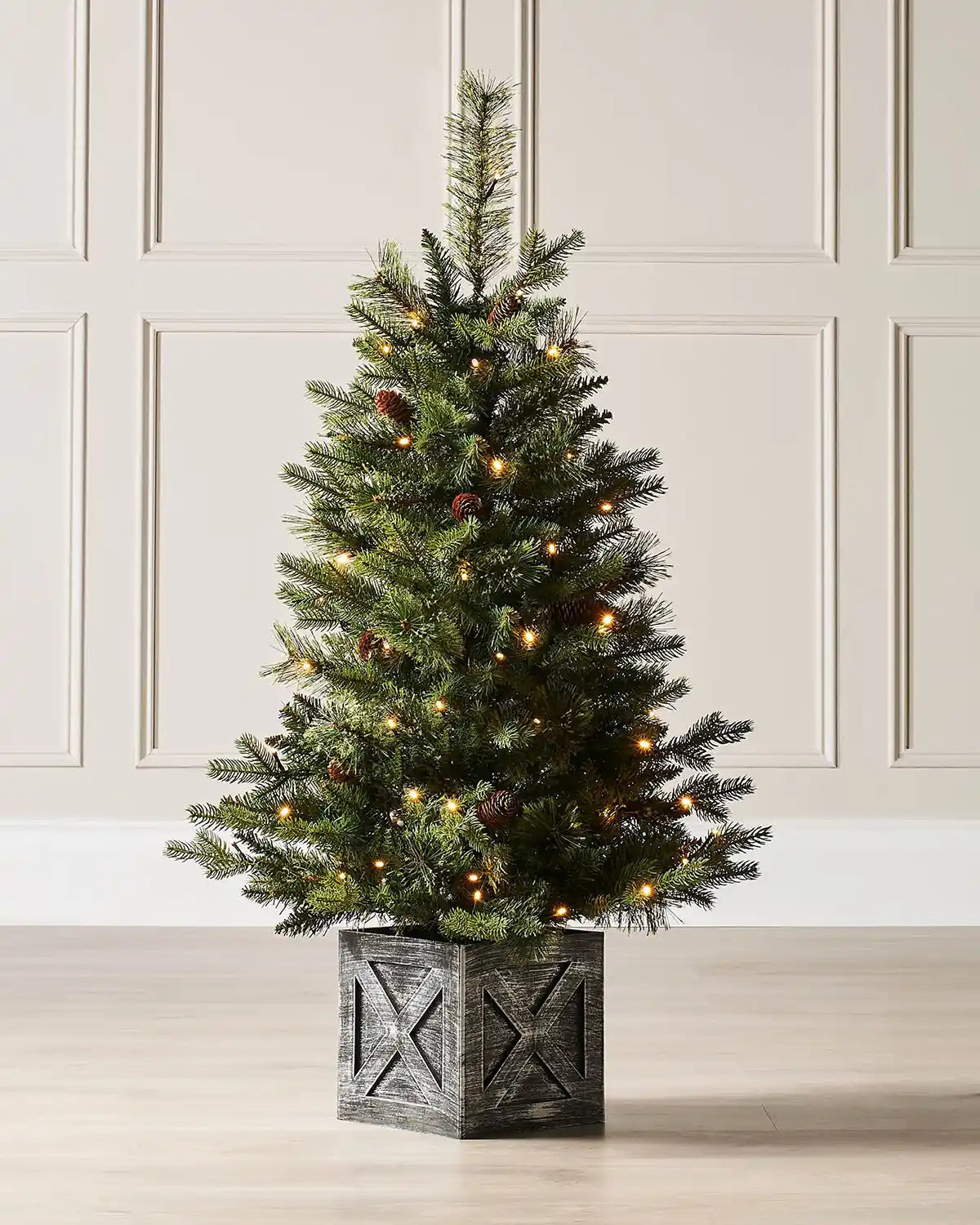 Pre-lit 3.5 ft natural pine potted Christmas tree in a grey wooden-effect pot with warm white lights