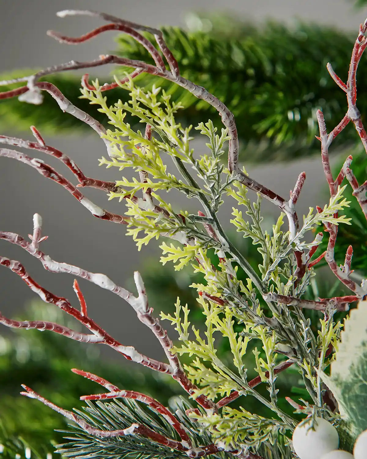 Close-up of frosted twigs and foliage on the 31 cm white berries pick