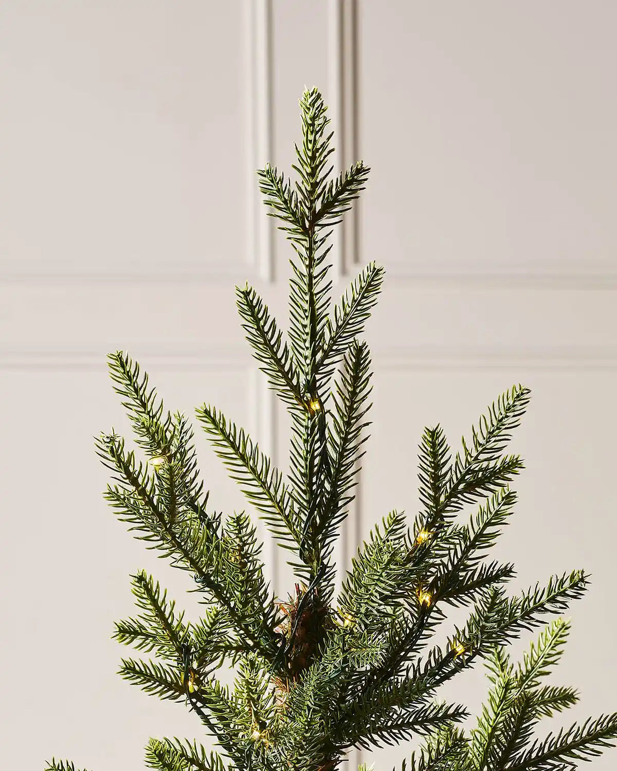 Top section detail of 3 ft pre-lit potted Douglas fir Christmas tree