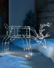 40 cm pre-lit 3D grazing reindeer silhouette displayed outdoors with warm white LEDs