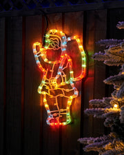 41 cm multi-coloured Santa with sack rope light displayed on a wooden fence