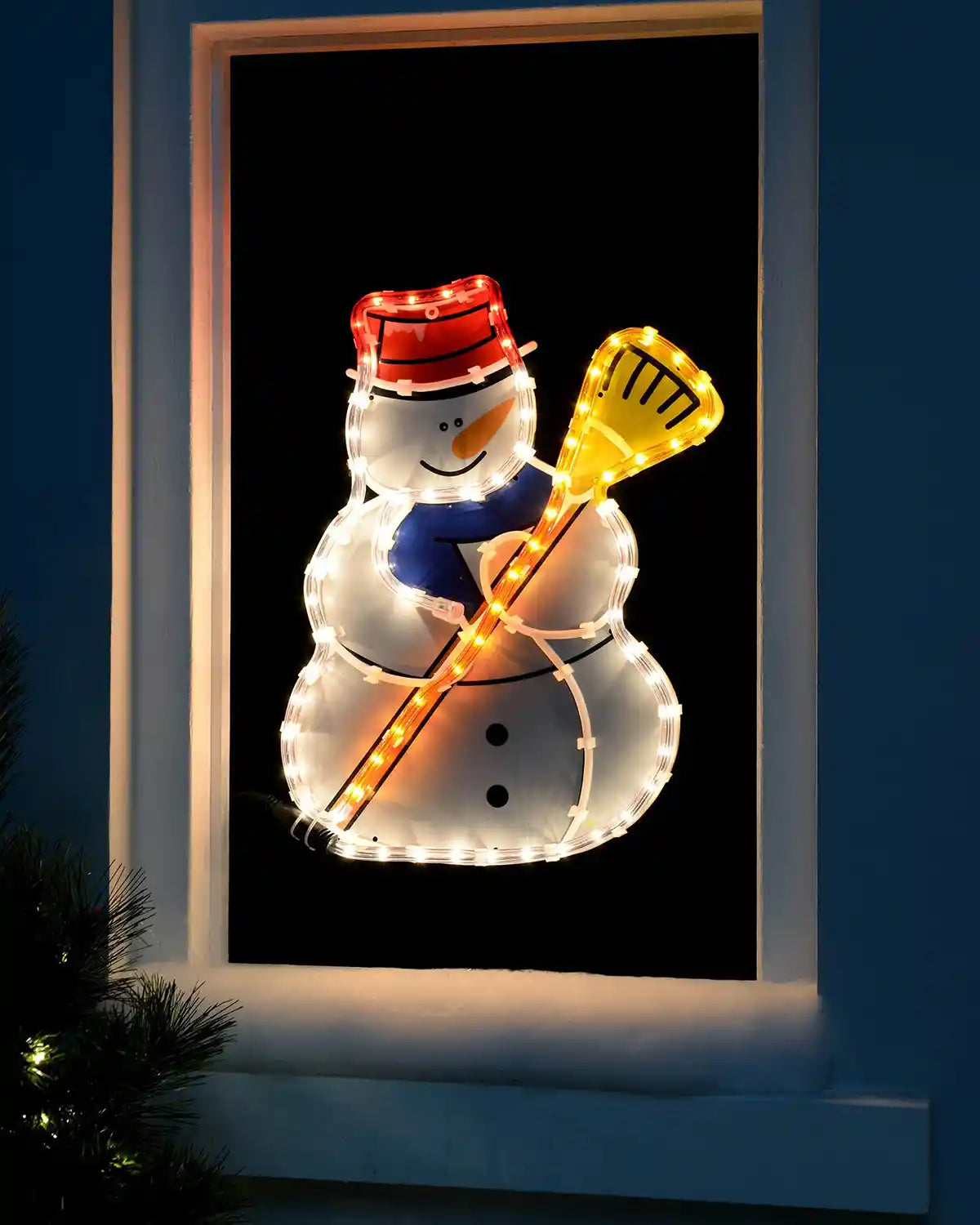 42 cm pre-lit snowman rope light displayed in a window with a broom and red hat