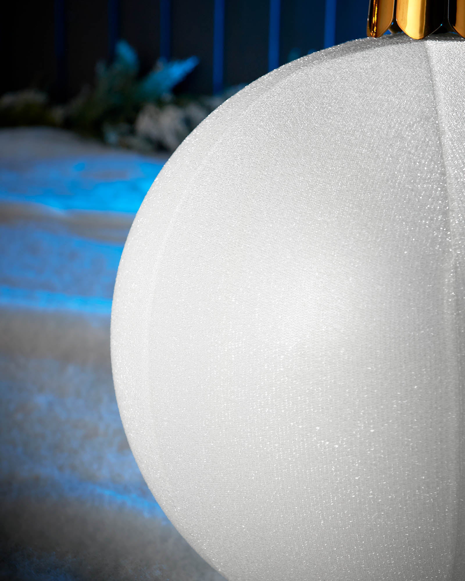 Detail close-up of the textured white tinsel surface on a 45cm inflatable Christmas bauble.