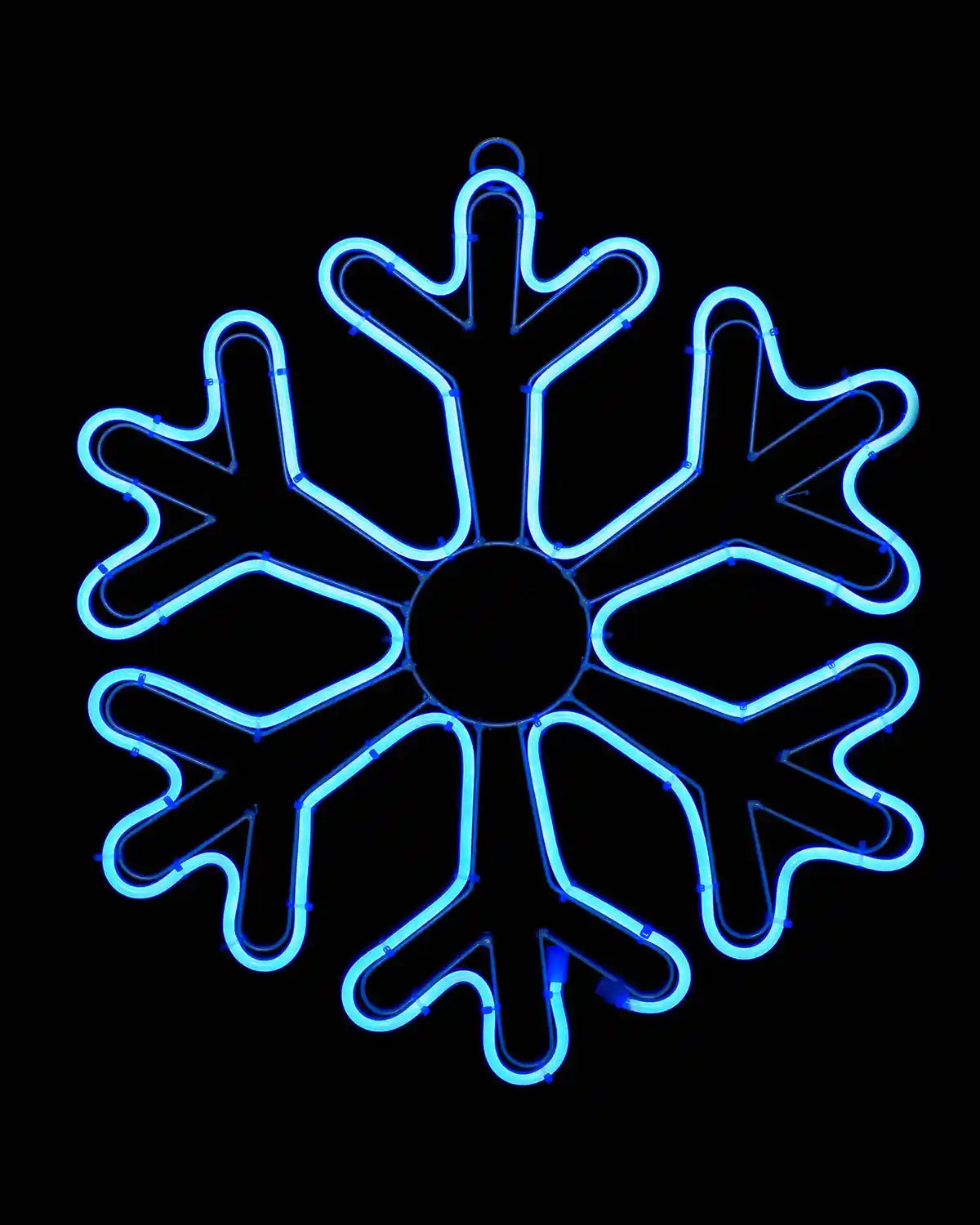 Blue snowflake neon rope light illuminated against a dark background