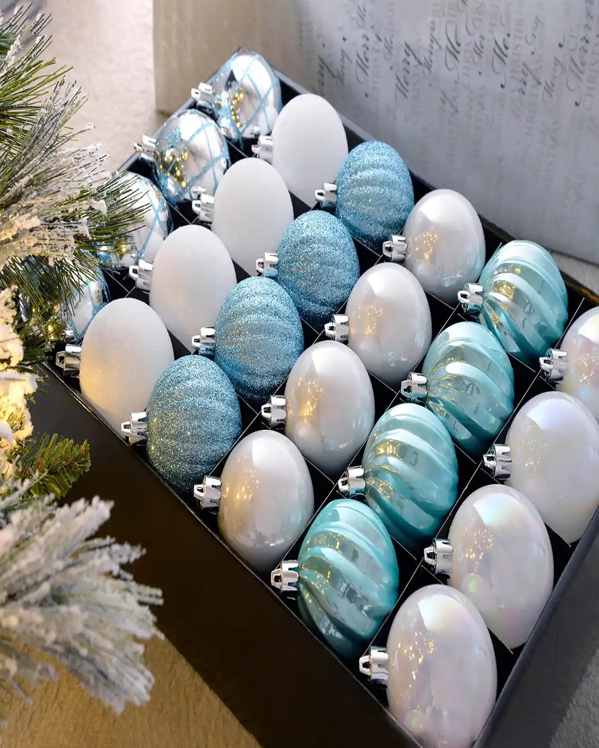 Set of 48 blue, white and silver 6cm shatterproof baubles arranged in a storage box