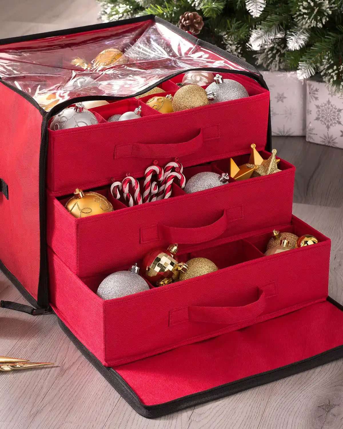 Red bauble storage box with drawers filled with Christmas decorations