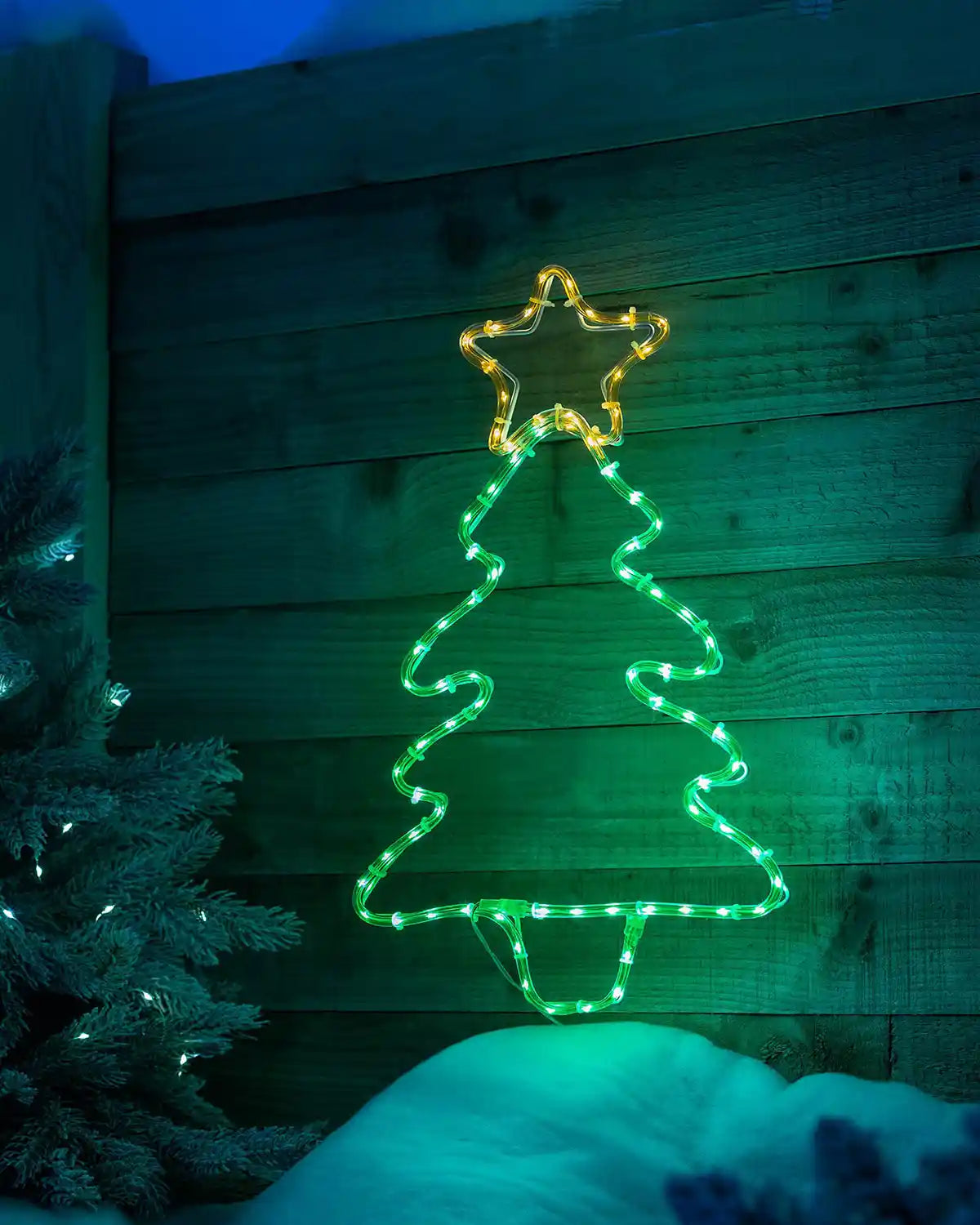 48 cm pre-lit Christmas tree rope light glowing in an outdoor festive scene