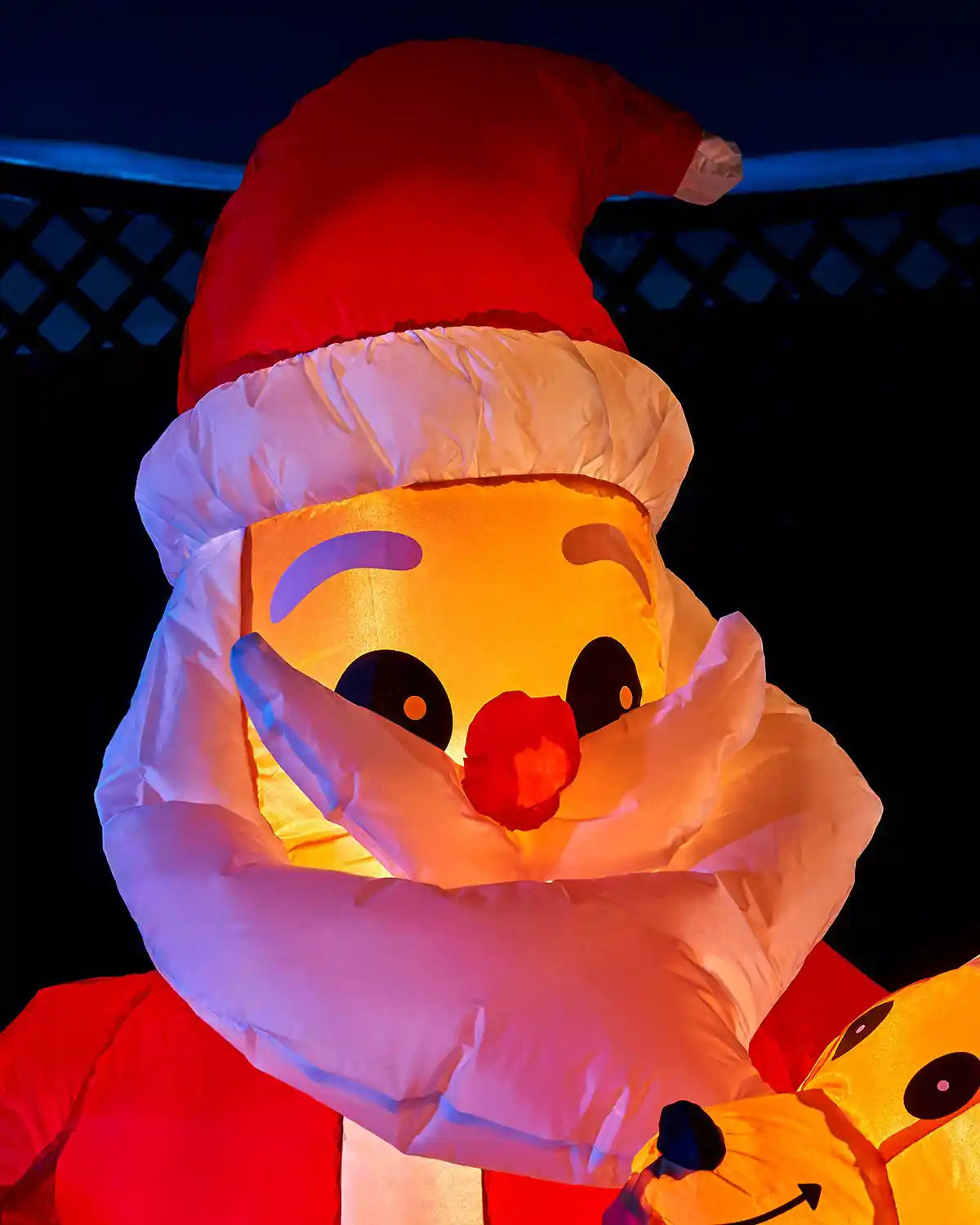 Close-up of the illuminated Santa face on the 4 ft inflatable Christmas display