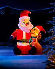4 ft pre-lit inflatable Santa with dog displayed outdoors at night