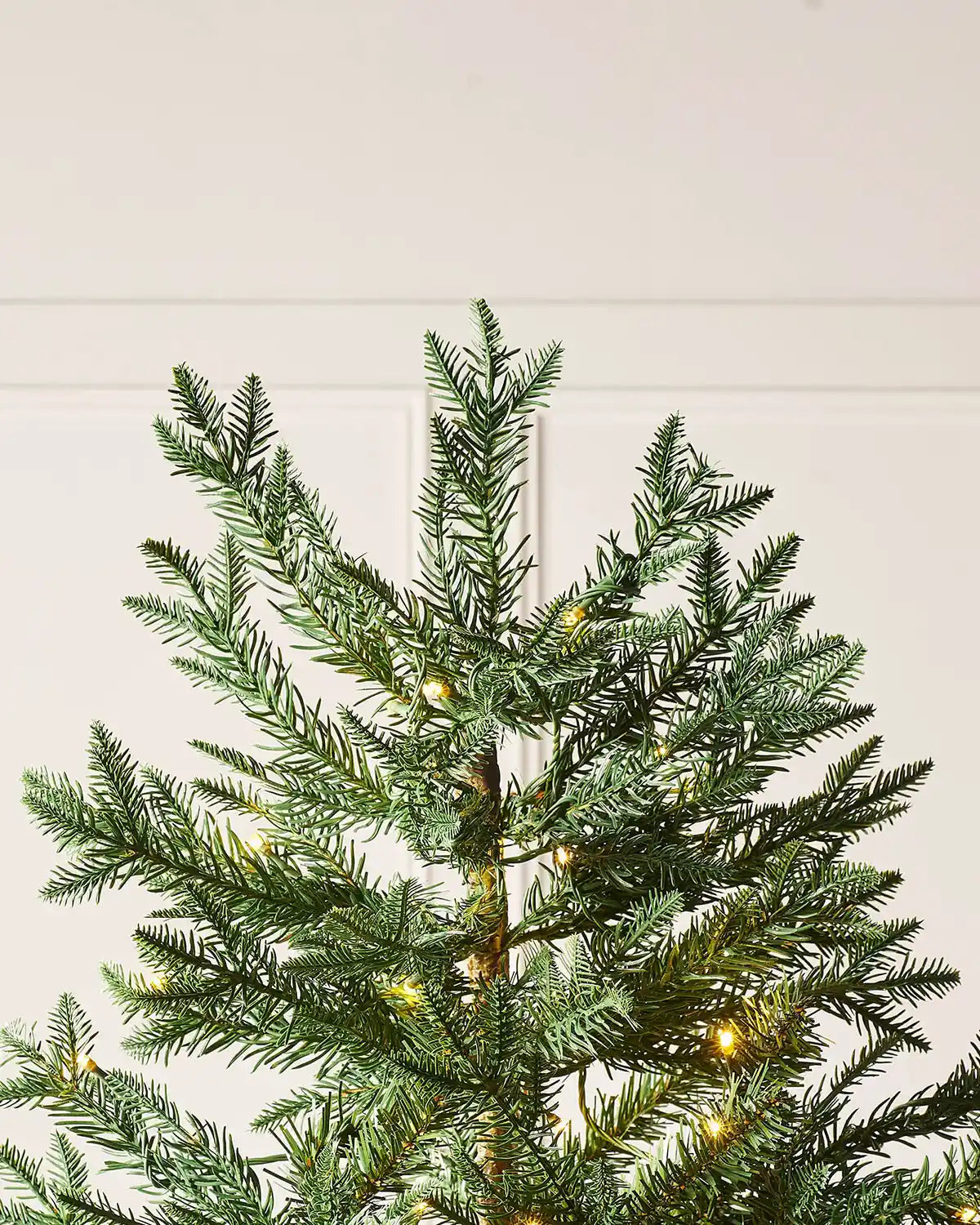 Top section of the 5 ft mixed pine Christmas tree with warm white lights