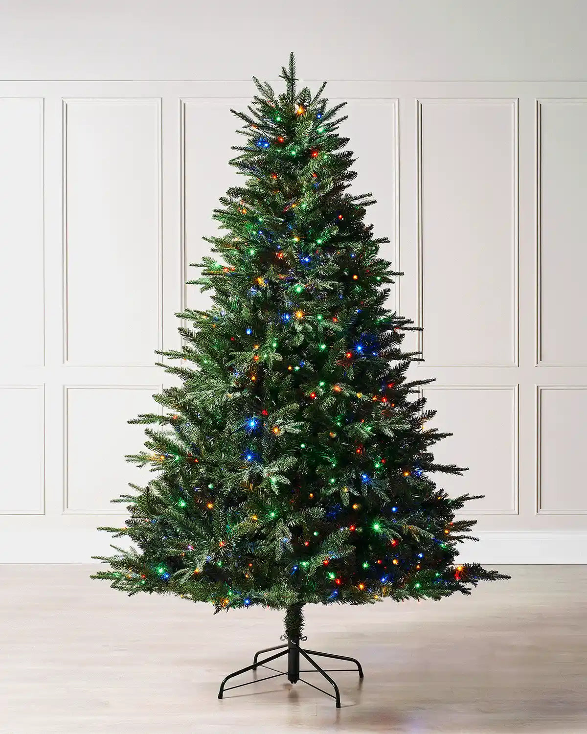 5ft Grand Alaskan Fir Christmas tree displayed indoors with dense green foliage and multicolour LED lights