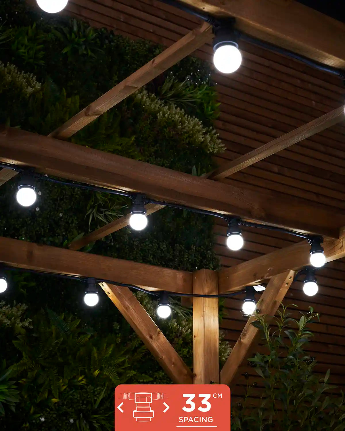 E27 festoon belt with 33cm socket spacing shown lit in white under a wooden pergola.