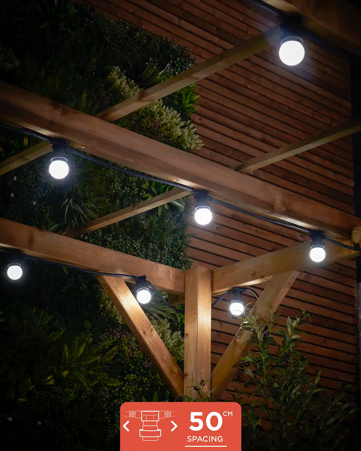E27 festoon belt with 50cm socket spacing shown lit in white under a wooden pergola.