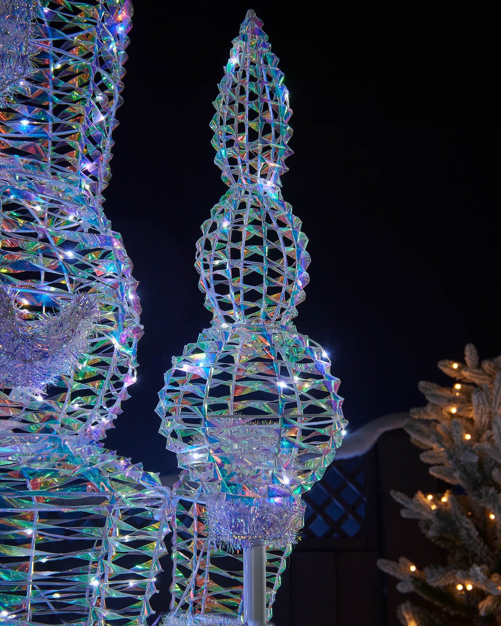 Detail of the iridescent Nutcracker staff with white LEDs and reflective frame.