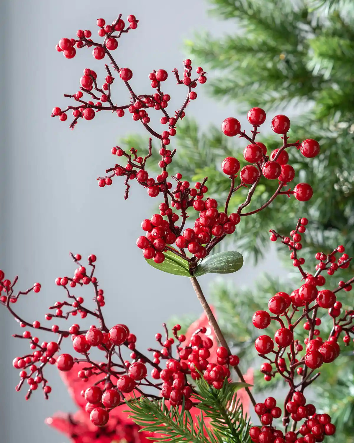 Close-up of glossy red berries on the 62 cm artificial tree pick