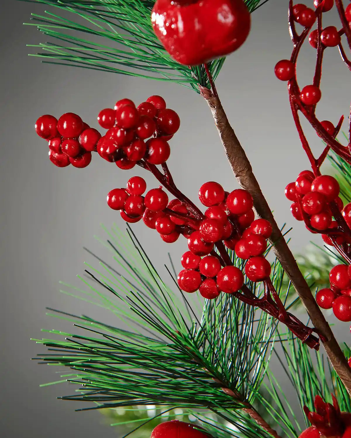 Close-up of glossy red berries on the 66 cm artificial tree pick