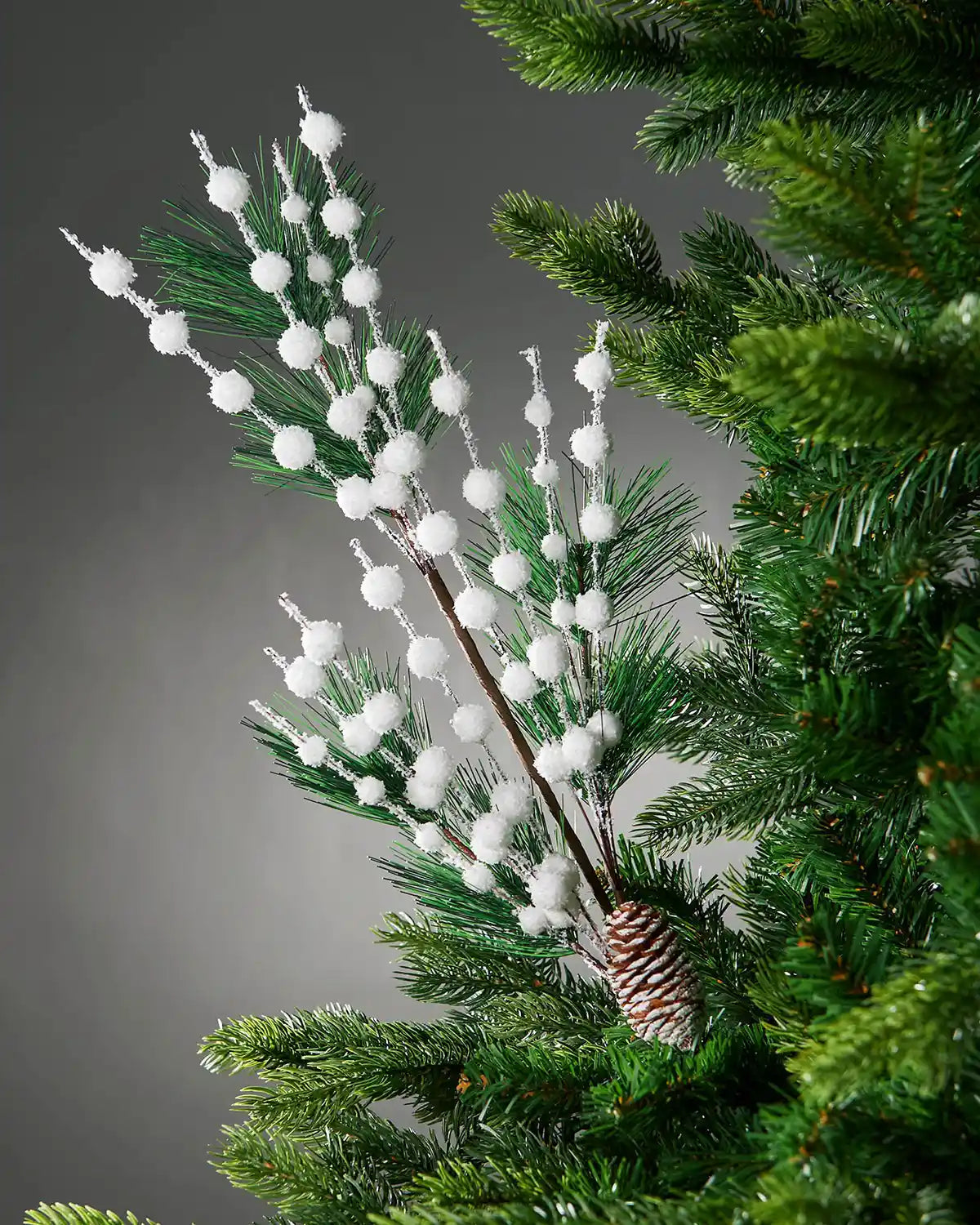 66 cm white artificial berries and pine cone pick styled in a Christmas tree