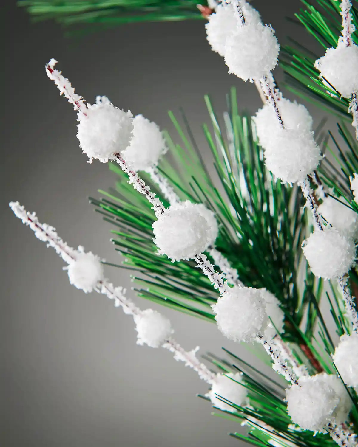 Close-up of frosted white berries and pine needles on the 66 cm tree pick
