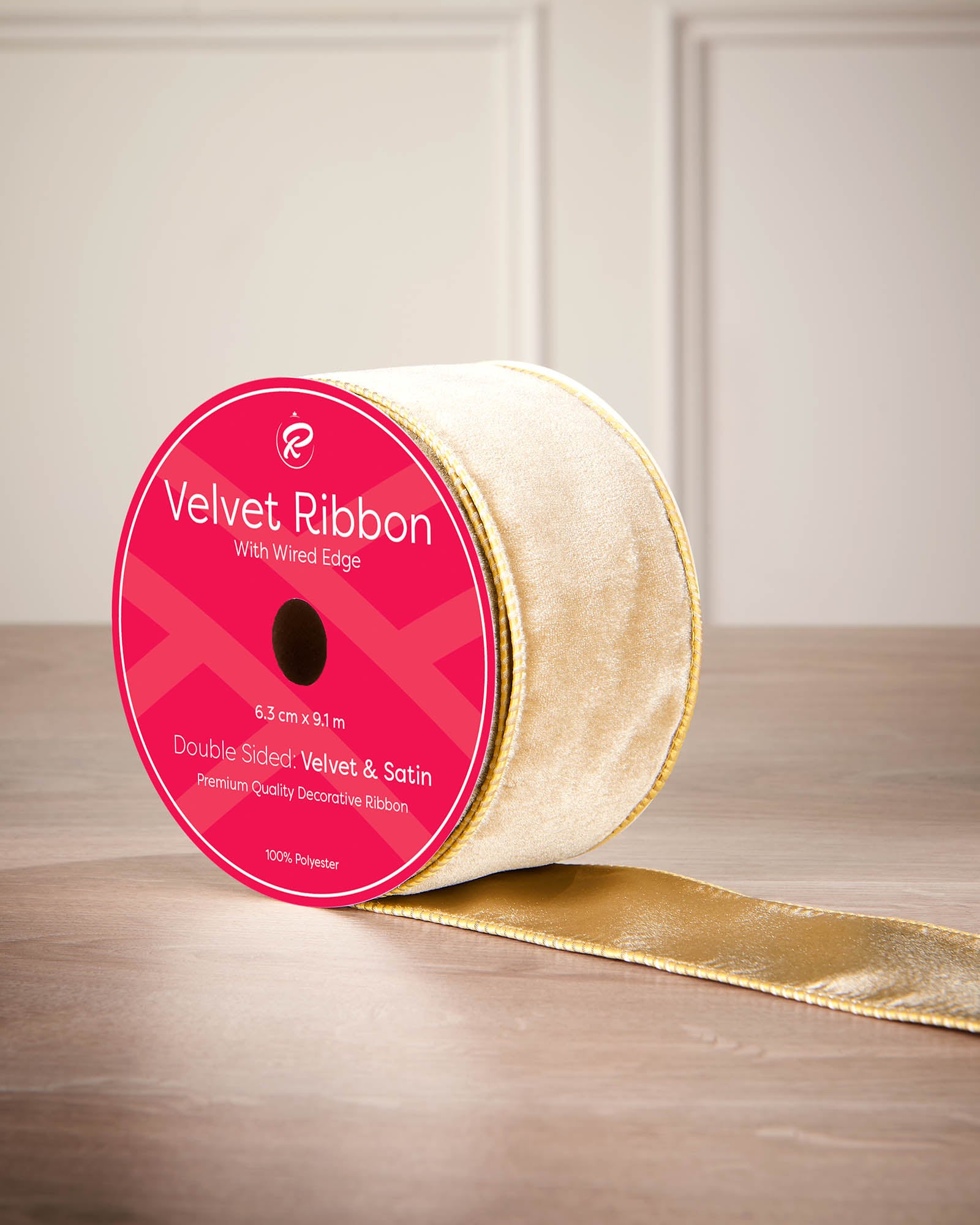 6 cm gold velvet ribbon on a spool with wired edge and 9 m length shown on the label.