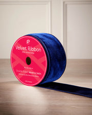 6 cm navy velvet ribbon on a spool with wired edge and 9 m length shown on the label.