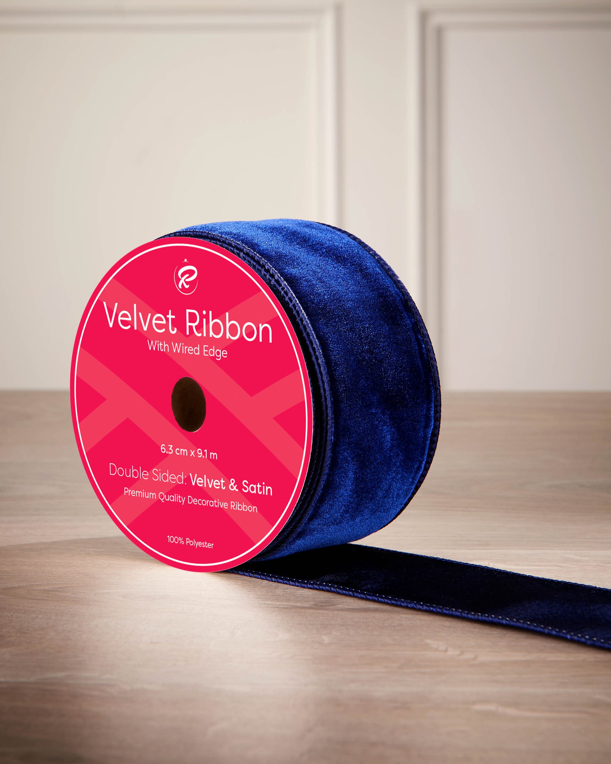 6 cm navy velvet ribbon on a spool with wired edge and 9 m length shown on the label.