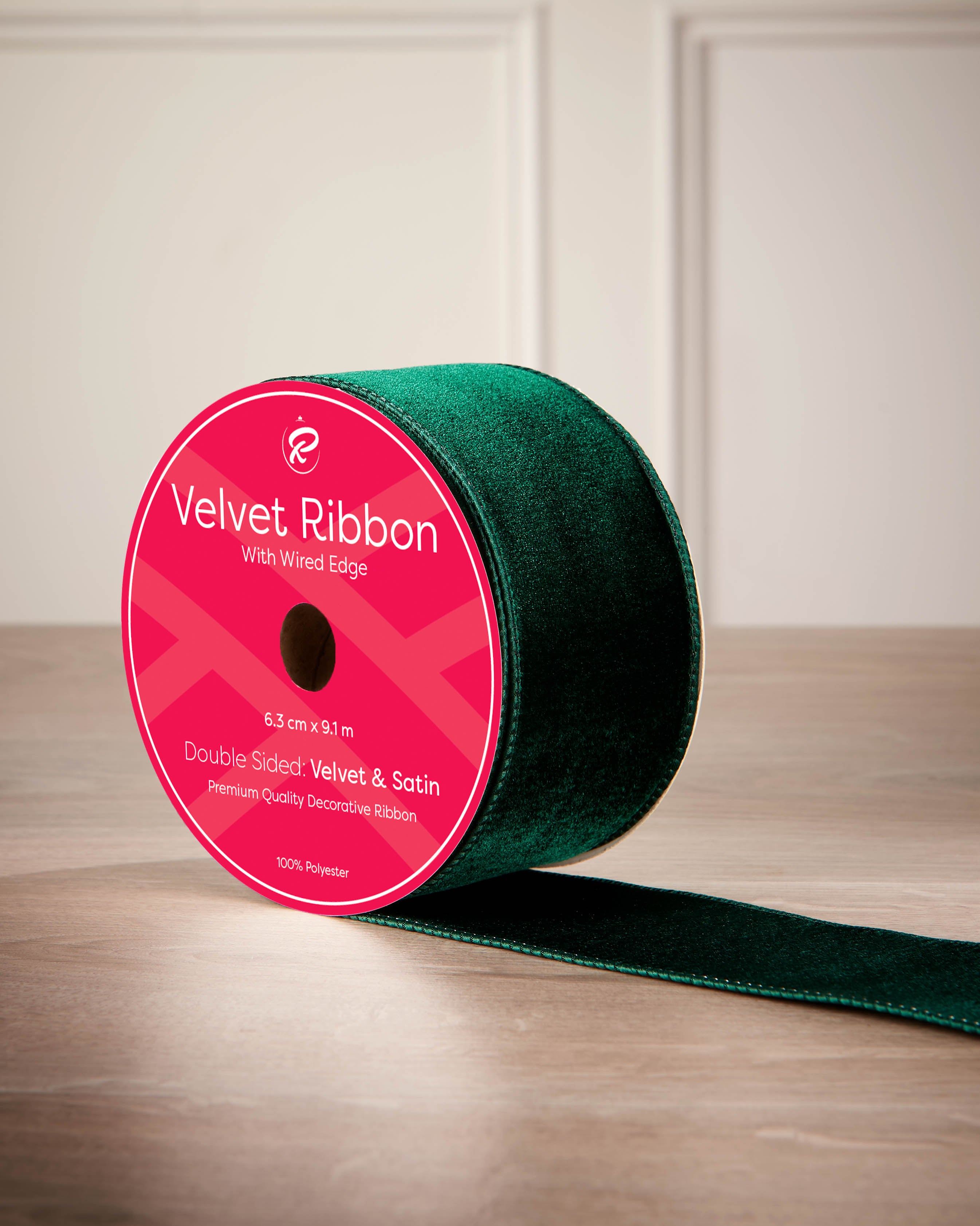 6 cm sage green velvet ribbon on a spool with wired edge and 9 m length shown on the label.